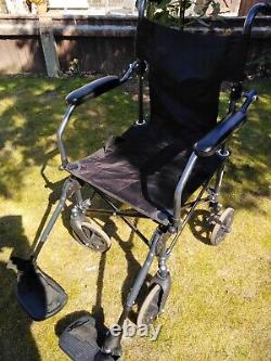 Adults new folding wheelchair. Folds up comes with separate cushion and bag