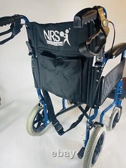 Lightweight folding NRS 29210 Transit travel wheelchair with handbrakes