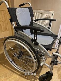 Lightweight folding self propelled wheelchair And Left Leg Raise