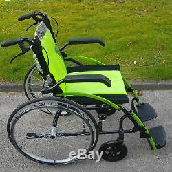 Lightweight small folding green self propelled wheelchair with attendant brakes